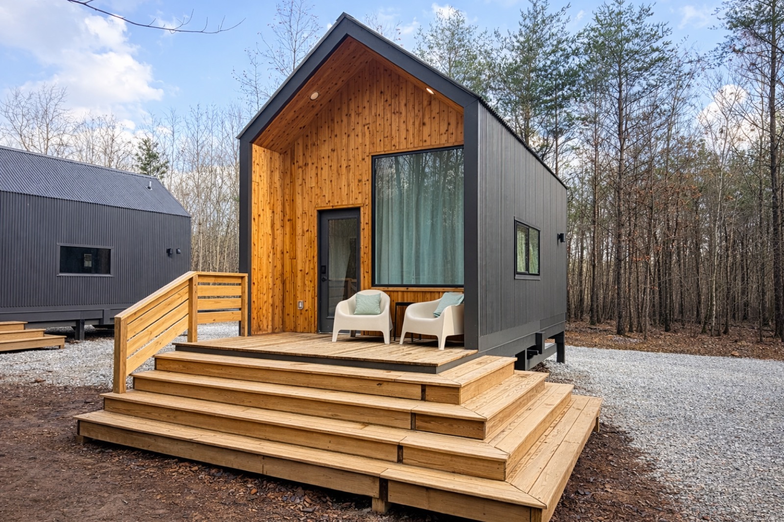 Cabin exterior nestled into the wooded plateau